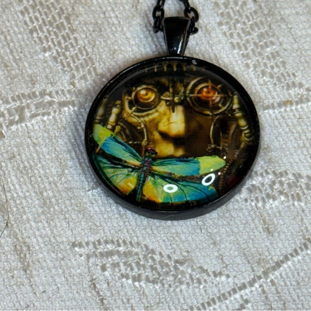 Mechanical or Scientist face and blue‎ butterfly/moth necklace. 24”
